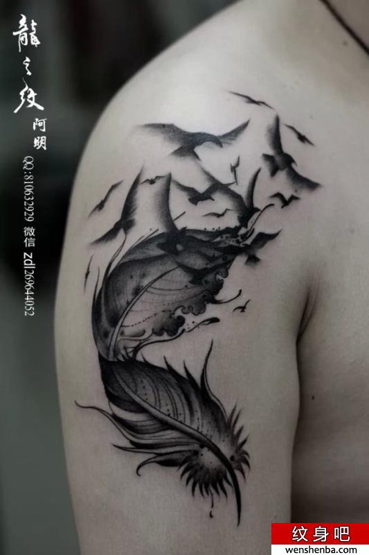 广州纹身分享大臂飘逸的羽毛文身